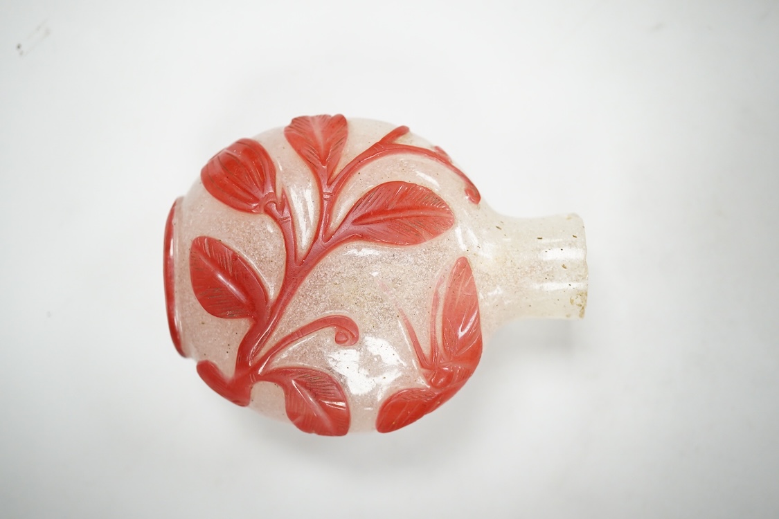 A Chinese cinnabar lacquer snuff bottle, a glass overlay snuff bottle and an underglaze copper red snuff bottle-9cm high (3)